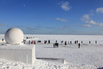 Winter walk beside the frozen sea.