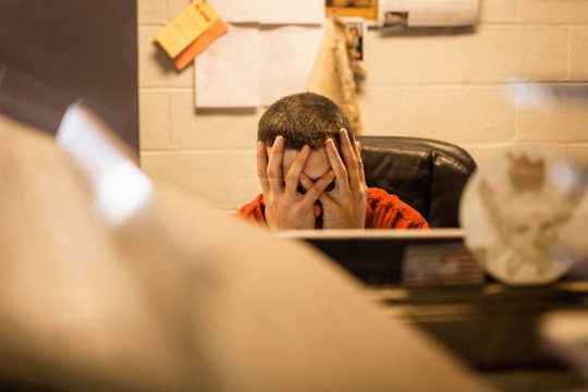 Overworked business owner sitting in warehouse office