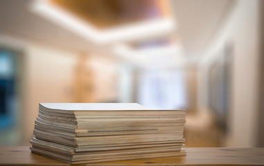 stack of old magazines on wooden table