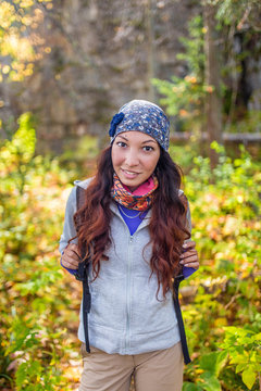 Hiker woman. Hiking portrait of happy young female hiker smiling looking at camera.