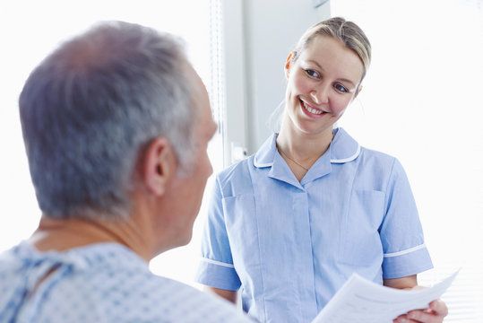 Nurse having conversation with patient