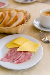 breakfast with with cheese and sausage on  table in  cafe