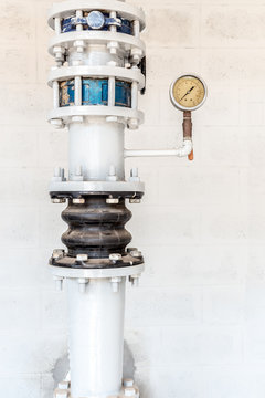 old pressure gauge and steel tube