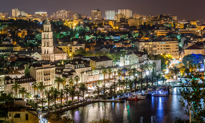 Fototapeta na wymiar Night cityscape town of Split, Croatia. / Aerial view on night panorama of old historic town of Split, Croatia. Town with beautiful architecture and history that attracts many tourists each summer.