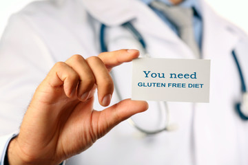 Doctor with text You need gluten free diet on badge closeup