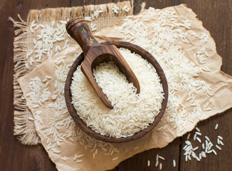 Pile of Basmati rice in a bowl with a spoon