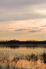 Evening scene near the lake with cloudy sky