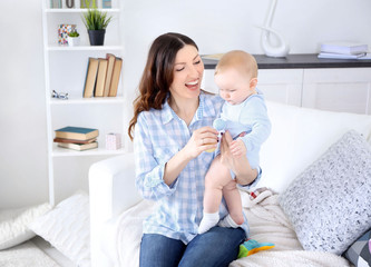 Happy woman with baby boy, closeup