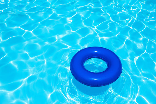 Blue buoy tube in swimming pool