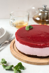 Delicious strawberry cheesecake on table