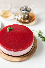 Delicious strawberry cheesecake on table