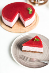 Delicious strawberry cheesecake on table
