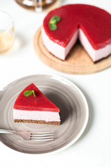 Delicious strawberry cheesecake on table