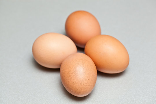 Four brown eggs