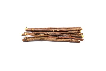Liquorice root lying on a white background