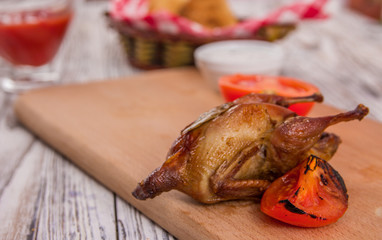 quail and grilled tomato