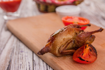 quail and grilled tomato