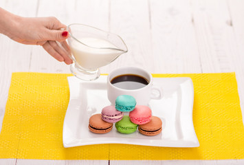 macaroon and a cup of coffee on the table