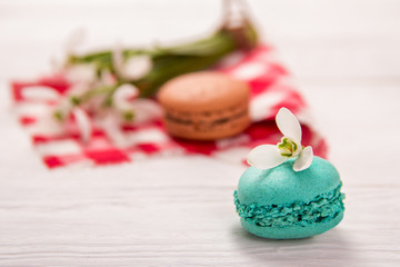 macaroon and snowdrops on the table