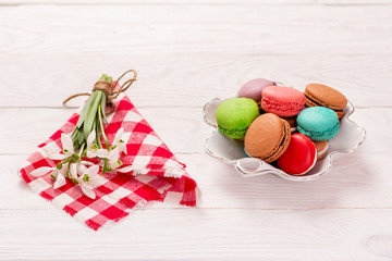 macaroon and snowdrops on the table