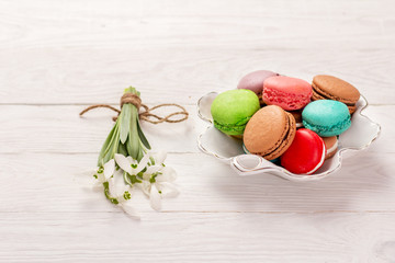 macaroon and snowdrops on the table