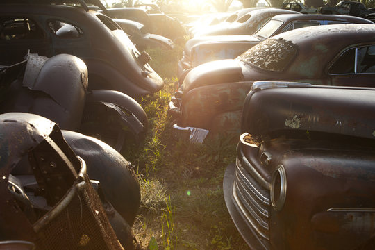 Vintage cars abandoned in scrap yard