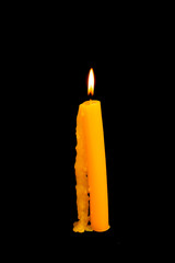 Lighting candles on a black background .