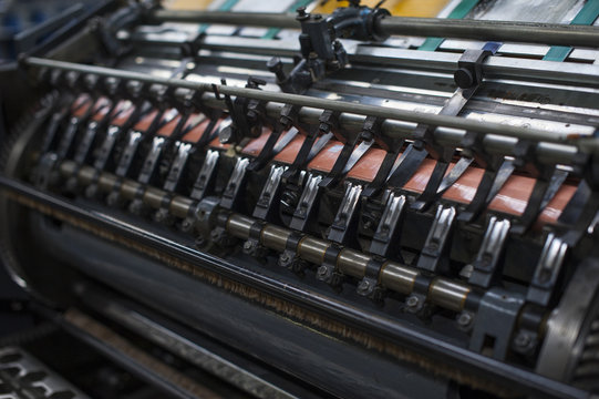 Close up of paper print machine in printing workshop