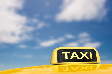 taxi sign on blue sky background