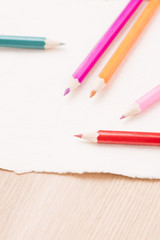 Colored pencils and drawing paper