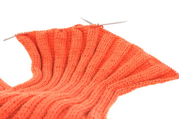 Knitting with metal knitting of cotton thread orange color Italian on a white background