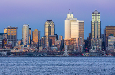 Fototapeta na wymiar Seattle skyline and Elliott Bay waterfront at sunset, Seattle, Washington, USA