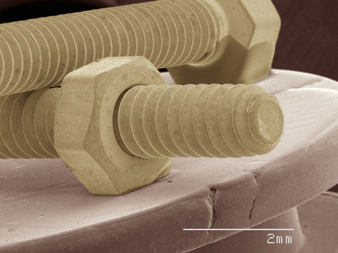 Coloured SEM of nut and bolt
