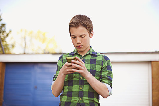 Boy using cell phone