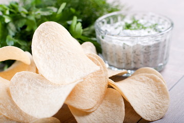 tasty potato chips and sauce