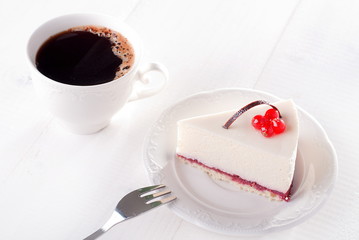 tasty piece of cake with berries in saucer
