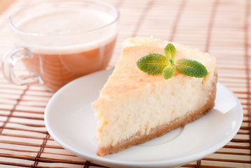 cheesecake on a plate with coffee