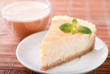 cheesecake on a plate with coffee