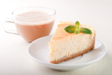 cheesecake on a plate with coffee