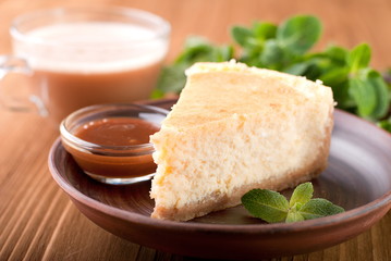 cheesecake with mint on a plate
