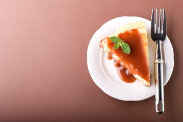 piece of cheesecake on the plate, top view
