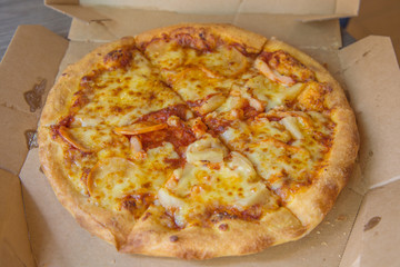 Pizza in the open boxes for ready to eat. Delicious food.