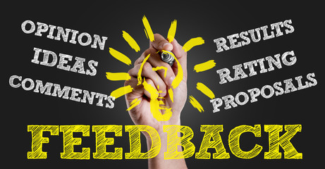Hand writing the text: Feedback