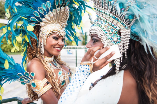Samba dancers with cellphone, Rio De Janeiro, Brazil