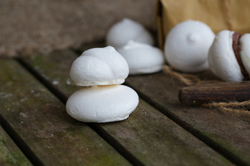 Fototapeta na wymiar Italian meringue on an old wooden surface.