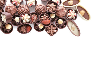 Delicious chocolate candies on white background