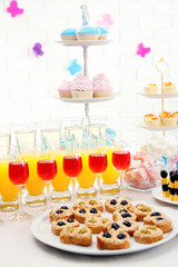 Set of cold snacks, canape, beverages and dessert, closeup