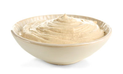 Ceramic bowl of tasty hummus, isolated on white