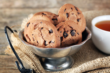 Chocolate chip cookies in a metal bowl on the tray