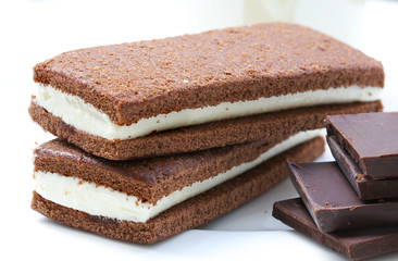Homemade chocolate sponge cake with fluffy milky filling. Closeu